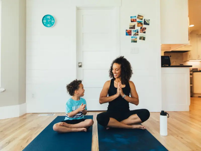 mom and son practice yoga