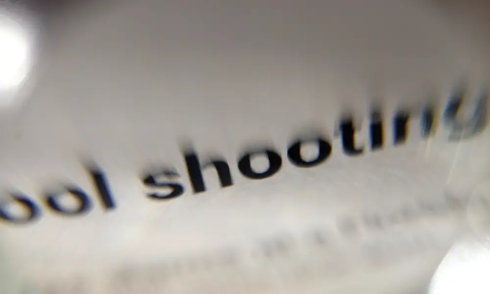the words "school shooting" blurred on a page